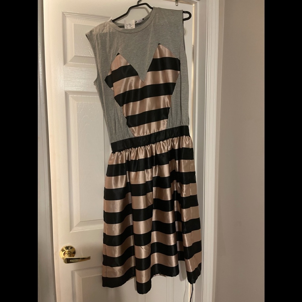 Beautiful Silver dress with heart on front. Medium. Brand new with tag